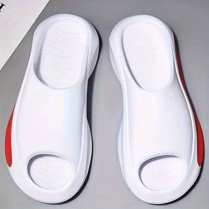 a pair of white shoes with red soles